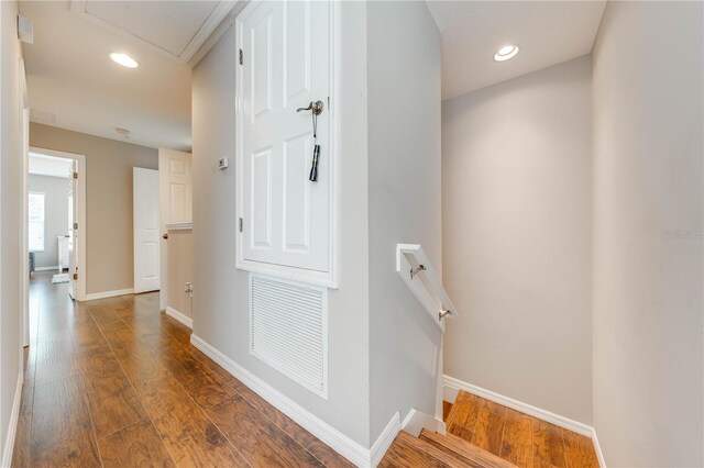 hall with hardwood / wood-style flooring