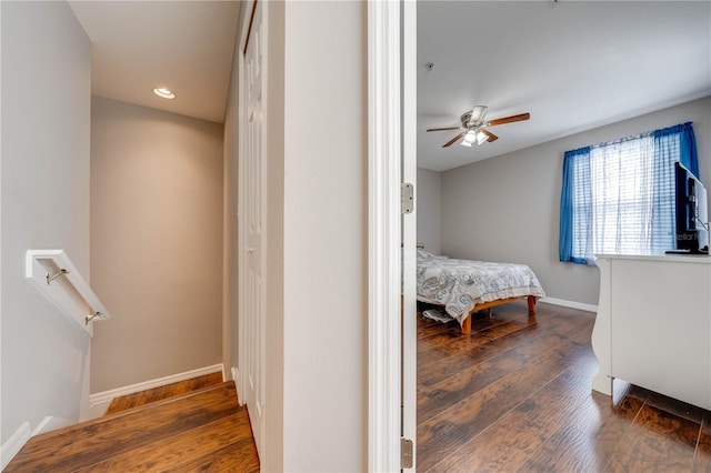 bedroom with hardwood / wood-style flooring and ceiling fan