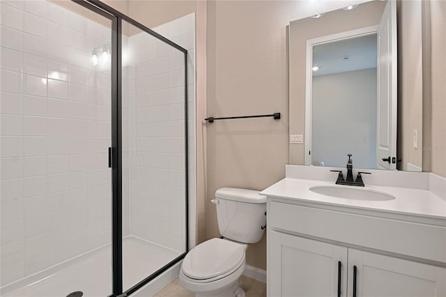 bathroom with vanity, toilet, and walk in shower