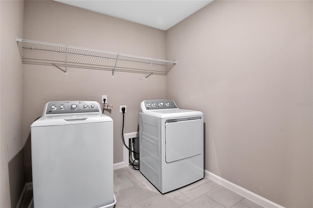 laundry room featuring washer and clothes dryer