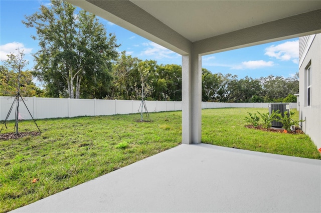 view of yard featuring a patio and central air condition unit