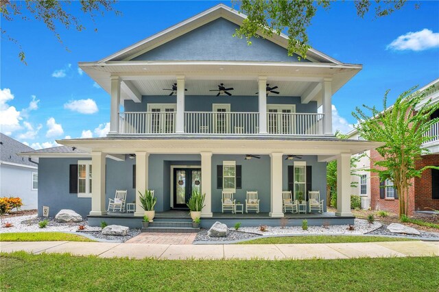 view of front of property with a porch, a balcony, and ceiling fan