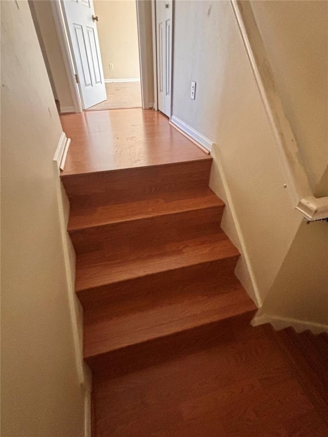 stairway featuring hardwood / wood-style flooring