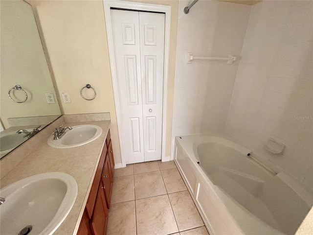 bathroom with tile patterned flooring and vanity