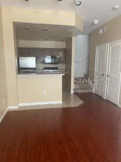 kitchen with dark wood-type flooring