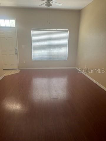 spare room featuring ceiling fan and wood-type flooring