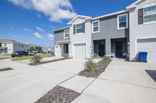 multi unit property featuring a garage