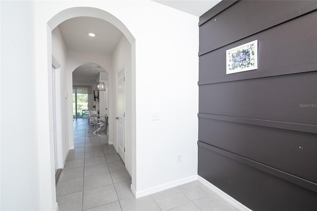 hallway featuring light tile patterned floors