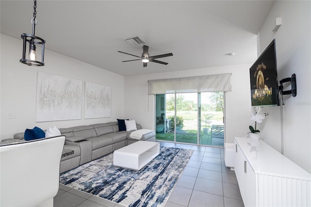 living room featuring light tile patterned flooring and ceiling fan