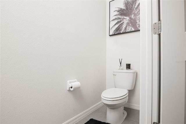 bathroom featuring tile patterned flooring and toilet