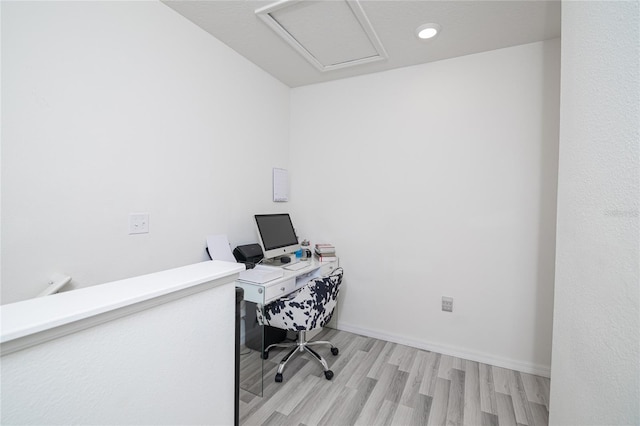 home office with light wood-type flooring