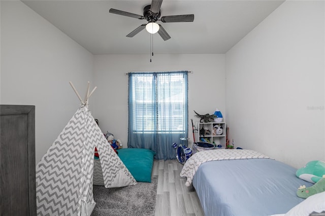 bedroom with hardwood / wood-style flooring and ceiling fan