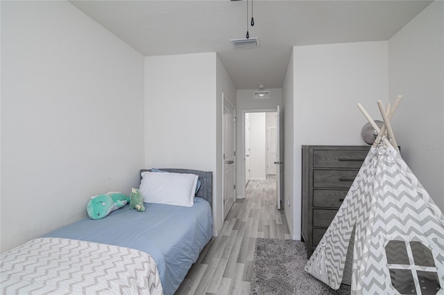 bedroom featuring light hardwood / wood-style flooring