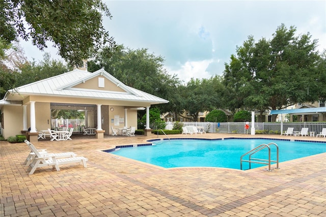 view of pool featuring a patio