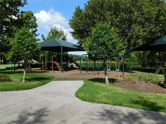 view of property's community with a playground