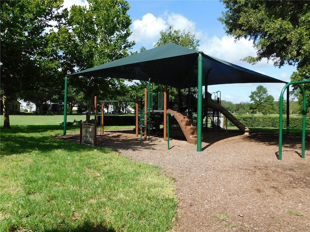 view of jungle gym with a lawn