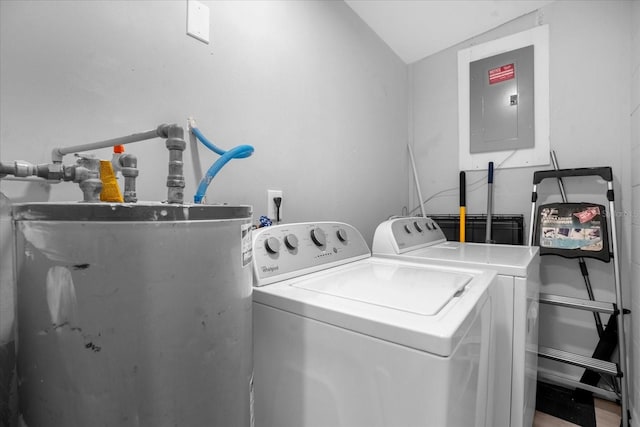 laundry room featuring washing machine and dryer, water heater, and electric panel