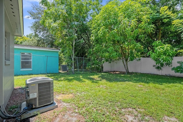 view of yard with central air condition unit