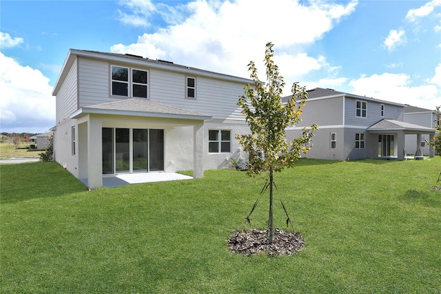 rear view of house with a lawn