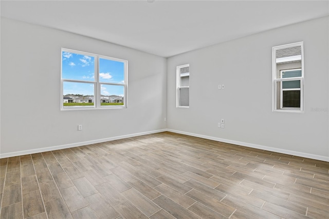 unfurnished room featuring light hardwood / wood-style flooring