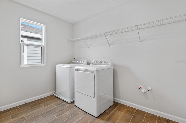 clothes washing area featuring independent washer and dryer