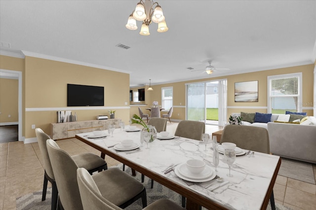 tiled dining area featuring ornamental molding and ceiling fan with notable chandelier