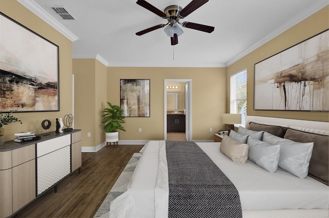 bedroom with ensuite bath, dark wood-type flooring, ceiling fan, and ornamental molding