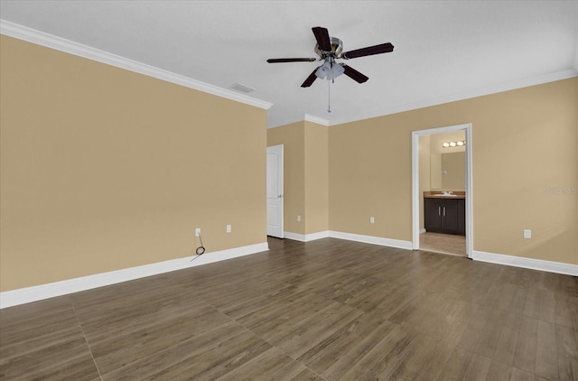 unfurnished room with ceiling fan and crown molding