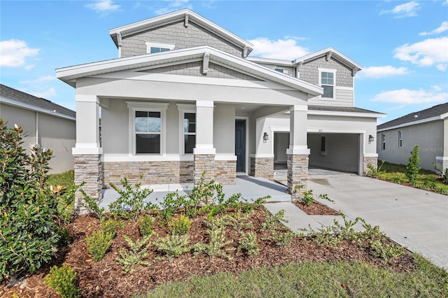 craftsman-style house featuring a garage and covered porch