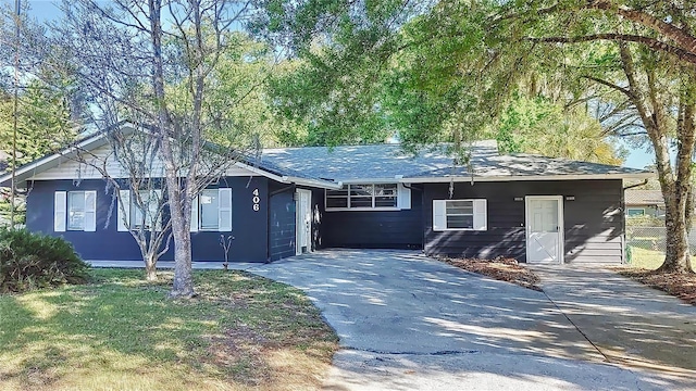 single story home with a garage and driveway