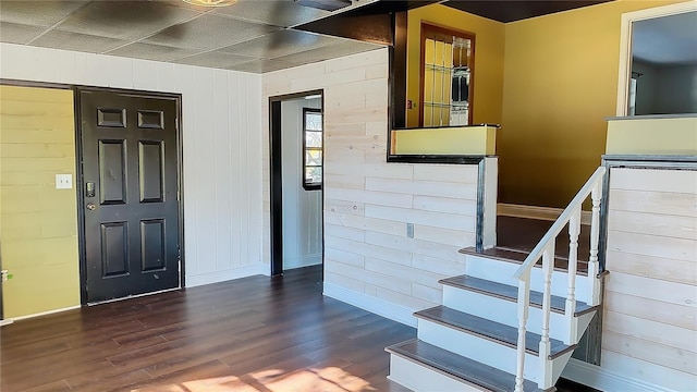 entrance foyer featuring a drop ceiling and hardwood / wood-style flooring