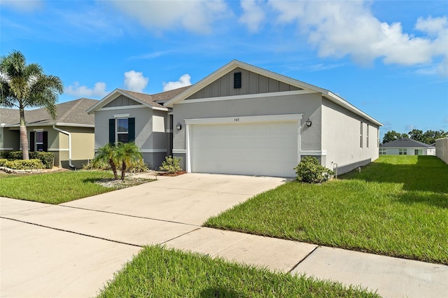 view of front of house with a front lawn and a garage