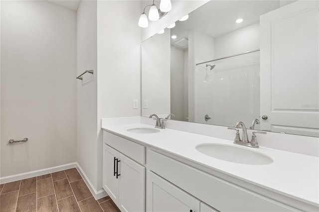 bathroom featuring vanity and a shower