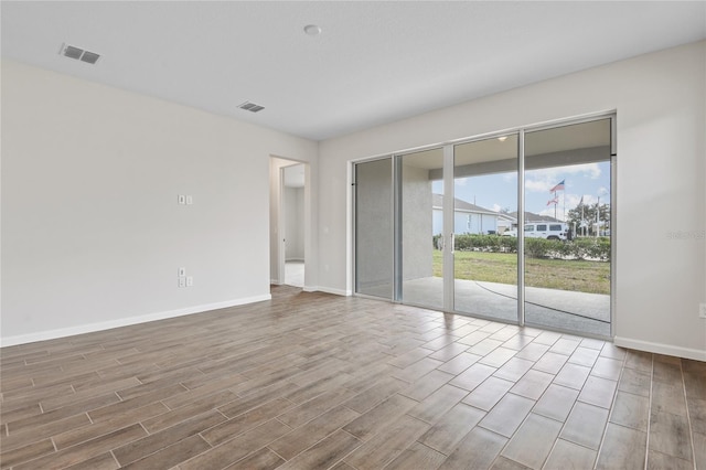 empty room featuring hardwood / wood-style floors