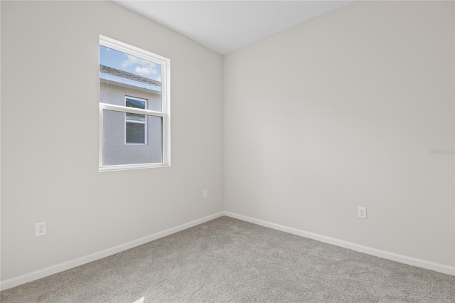 unfurnished room with carpet floors