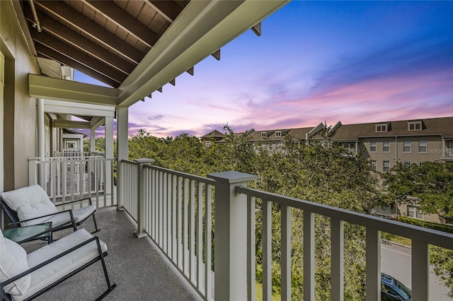 view of balcony at dusk