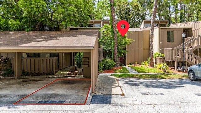 exterior space with a carport