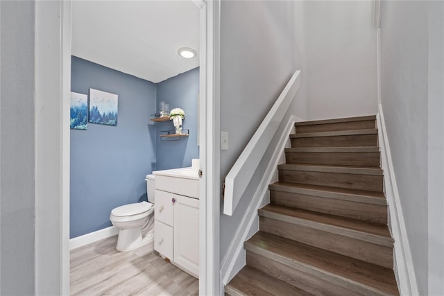 staircase featuring light hardwood / wood-style flooring