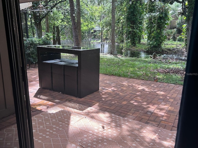 view of patio / terrace with a water view