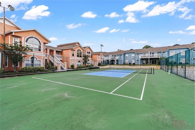 view of sport court with basketball hoop