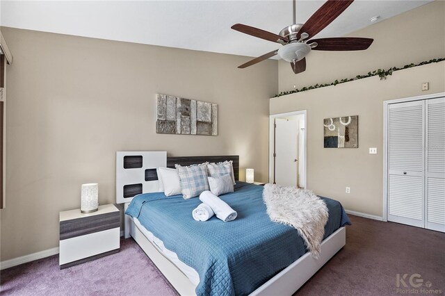 carpeted bedroom featuring lofted ceiling, a closet, and ceiling fan