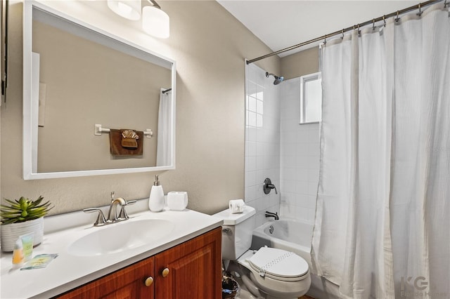 full bathroom featuring toilet, vanity, and shower / bathtub combination with curtain