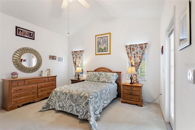 bedroom featuring vaulted ceiling, ceiling fan, and light colored carpet