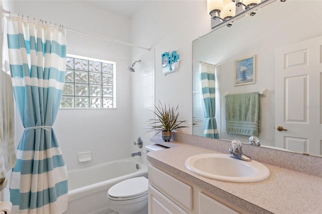 full bathroom with shower / tub combo, vanity, and toilet