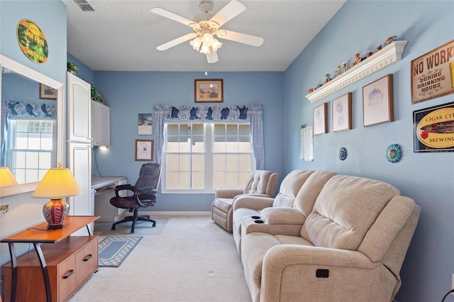 living room with light colored carpet and ceiling fan