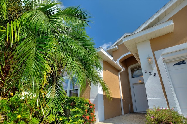 property entrance with a garage