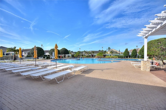 view of pool featuring a patio and a pergola