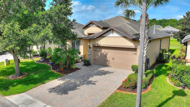 view of front of property with a garage and a front yard