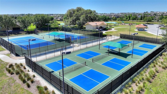 view of sport court with fence