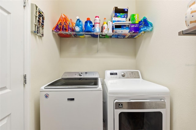 washroom featuring laundry area and independent washer and dryer